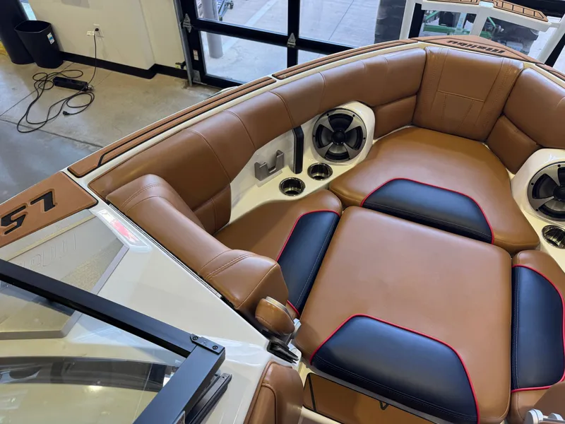 Slide: The Image of Interior of a 2021 Malibu Wakesetter 23 LSV with brown and black upholstery. - 18