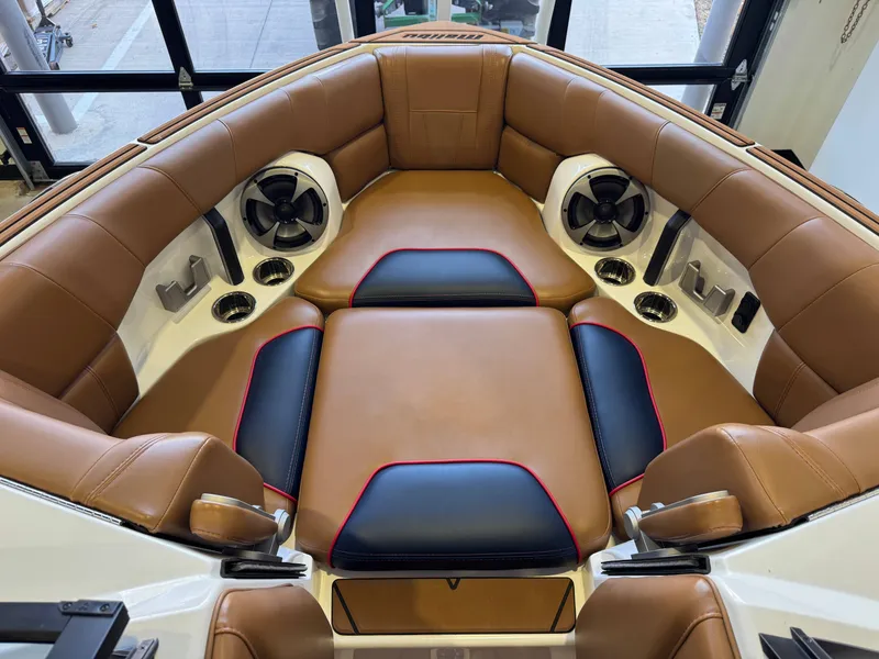 Slide: The Image of Interior of the Malibu Wakesetter 23 LSV with brown leather seats and speakers. - 16