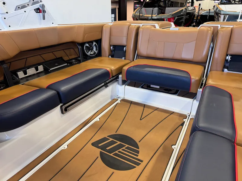 Slide: The Image of Interior of a 2021 Malibu Wakesetter 23 LSV with brown and blue seating. - 14