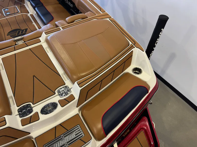 Slide: The Image of The image shows the brown and cream interior of a 2021 Malibu Wakesetter 23 LSV. - 10