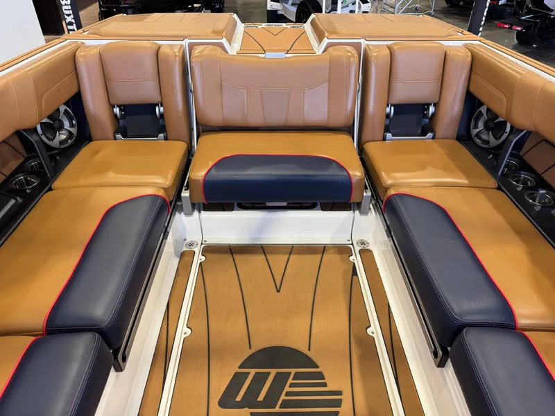 Slide: The Image of Interior of a Malibu Wakesetter 23 LSV with brown and blue seating, stylish design. - 26