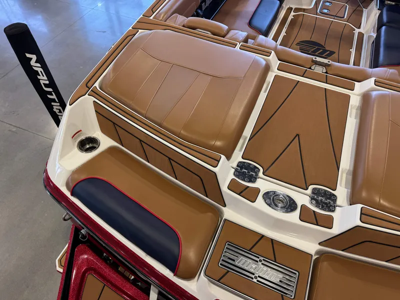 Slide: The Image of The image shows the rear of a 2021 Malibu Wakesetter 23 LSV with brown upholstery. - 11