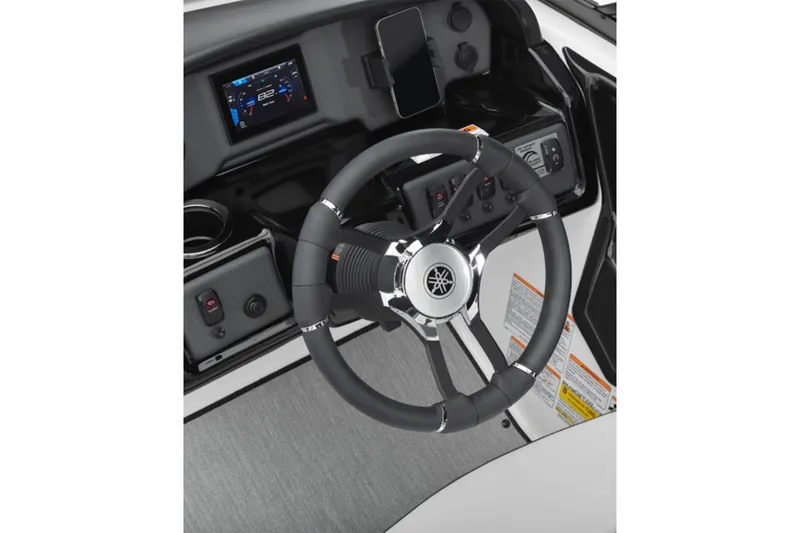 Slide: The Image of The image shows the helm of a Yamaha AR195 boat with a modern dashboard and smartphone holder. - 5