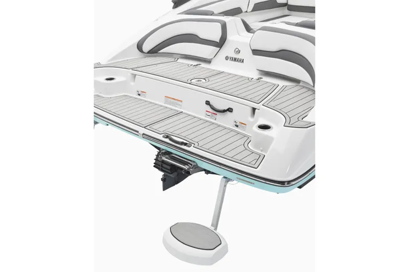Slide: The Image of The image shows the stern of a Yamaha AR195 boat with gray and white upholstery. - 3