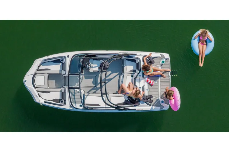 Slide: The Image of A 2026 Yamaha AR195 on green water with people on board and one person in the water. - 12