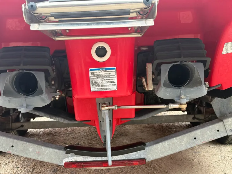 Slide: The Image of Red stern of a Yamaha 242X boat with two jet drives and a trailer. - 16