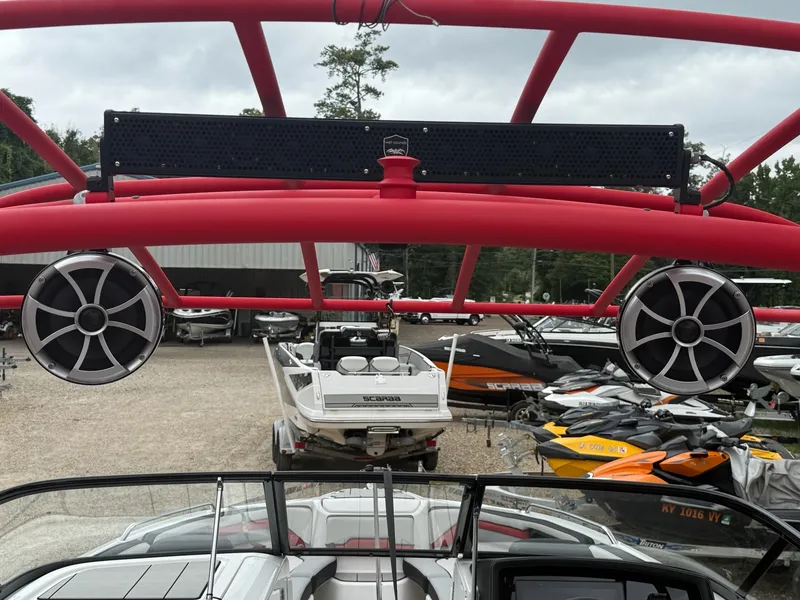 Slide: The Image of A 2020 Yamaha 242X boat with a striking red roll bar and large speakers. - 15