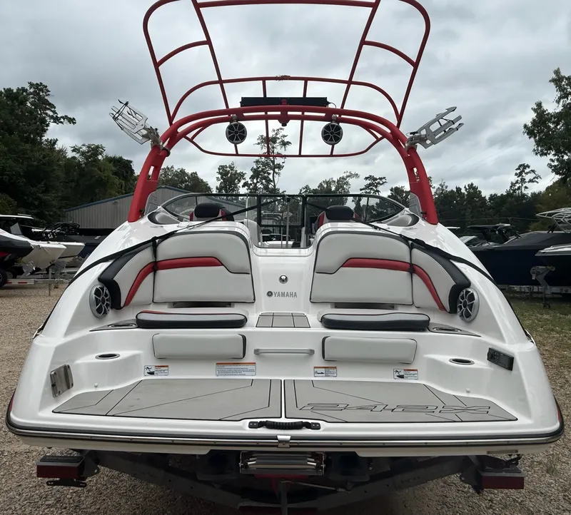 Slide: The Image of The image shows a 2020 Yamaha 242X boat with a red wakeboard tower and speakers. - 7