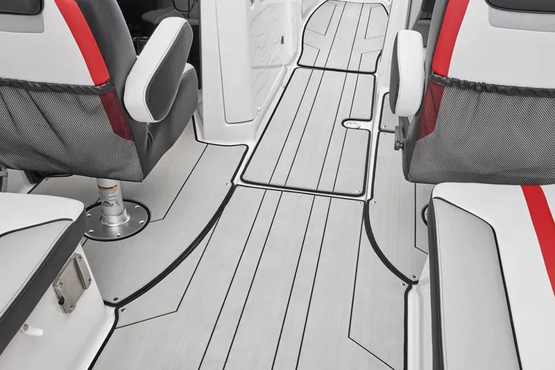 Slide: The Image of The image shows the interior of a 2020 Yamaha 242X boat with modern seating and stylish flooring. - 26