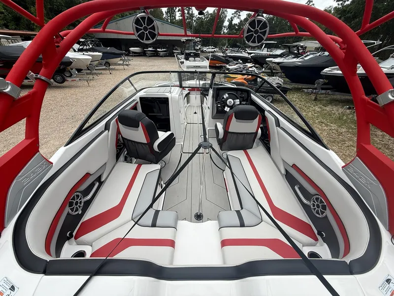 Slide: The Image of The image shows the interior of a 2020 Yamaha Boats 242X with modern seating and speakers. - 9