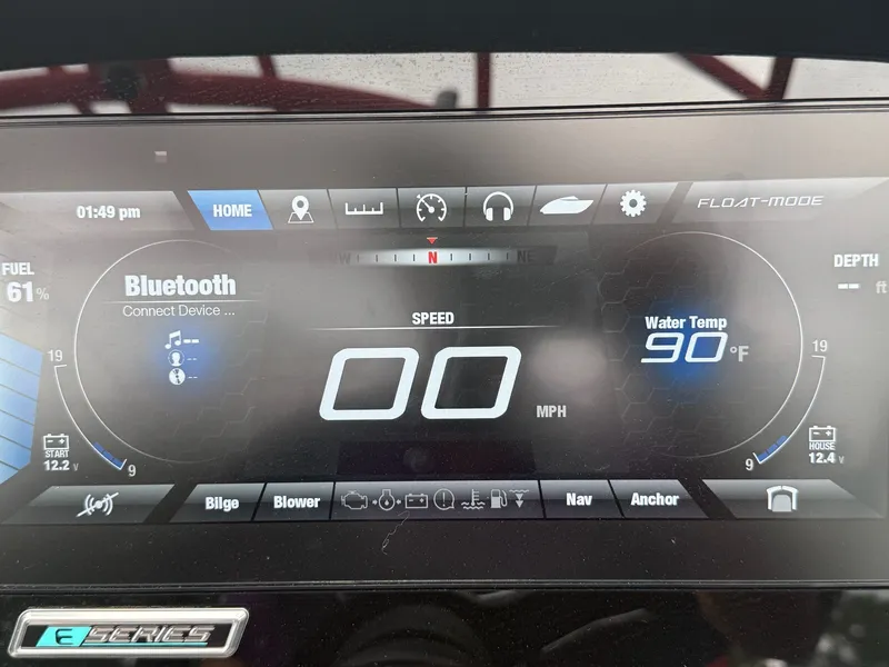 Slide: The Image of Yamaha Boats 2020 242X dashboard with digital display, Bluetooth, speed, and water temperature readings. - 12