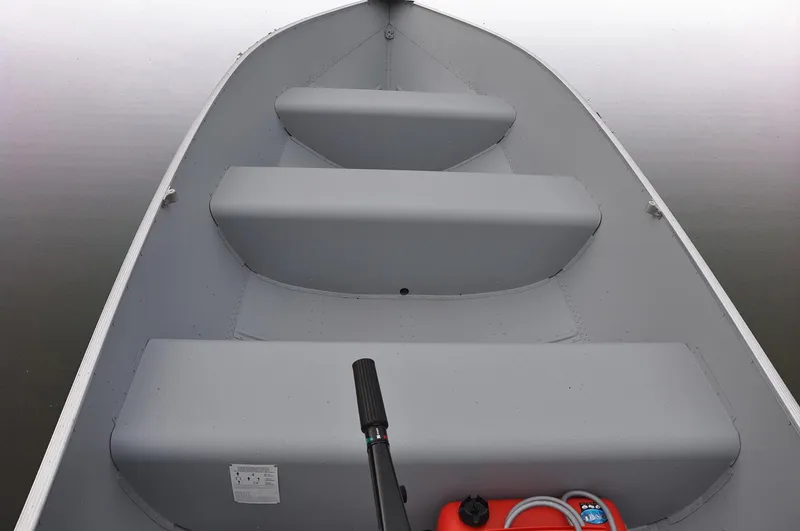 Slide: The Image of Manufacturer Provided Image: 2022 Lund A-12 boat interior with seating and motor handle. - 14