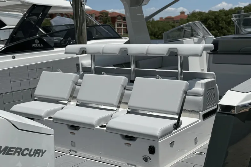 Slide: The Image of The image shows the cockpit of a 2024 Aviara AV40 OB with modern white seating. - 13