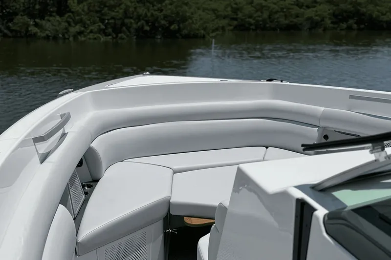 Slide: The Image of The image shows the bow area of a 2024 Aviara AV40 OB with white cushioned seating. - 30