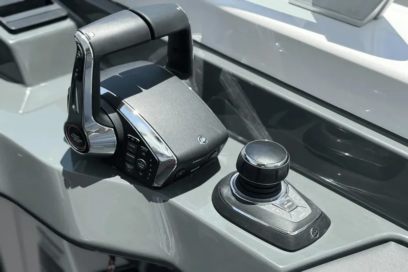 Slide: The Image of Close-up of the helm console on a 2024 Aviara AV40 OB with modern controls. - 27