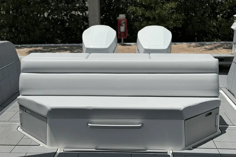 Slide: The Image of The 2024 Aviara AV40 OB features a stylish, cushioned bench seat on a modern deck. - 15