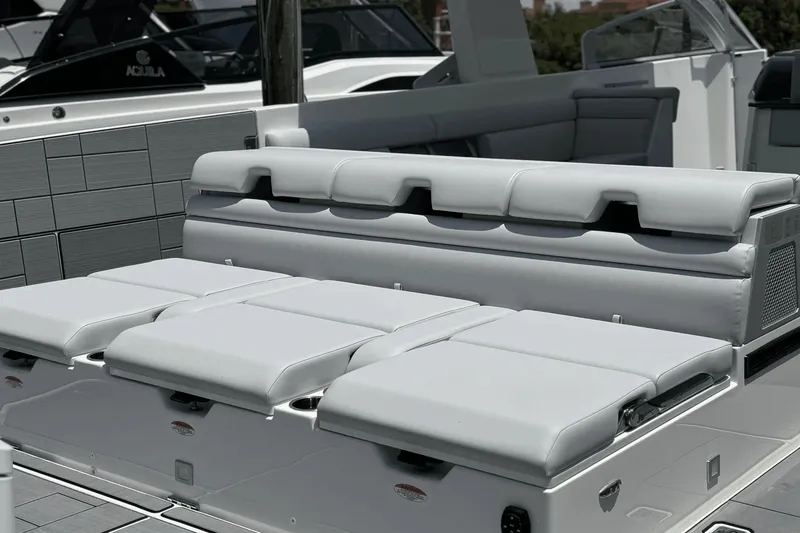 Slide: The Image of The image shows the cockpit of a 2024 Aviara AV40 OB with luxurious white cushioned seating. - 41