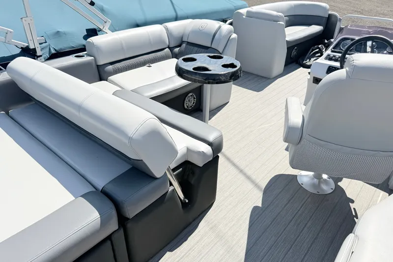 Slide: The Image of 2020 Godfrey Sweetwater 2286 C pontoon boat interior with plush seating and cup holders. - 14