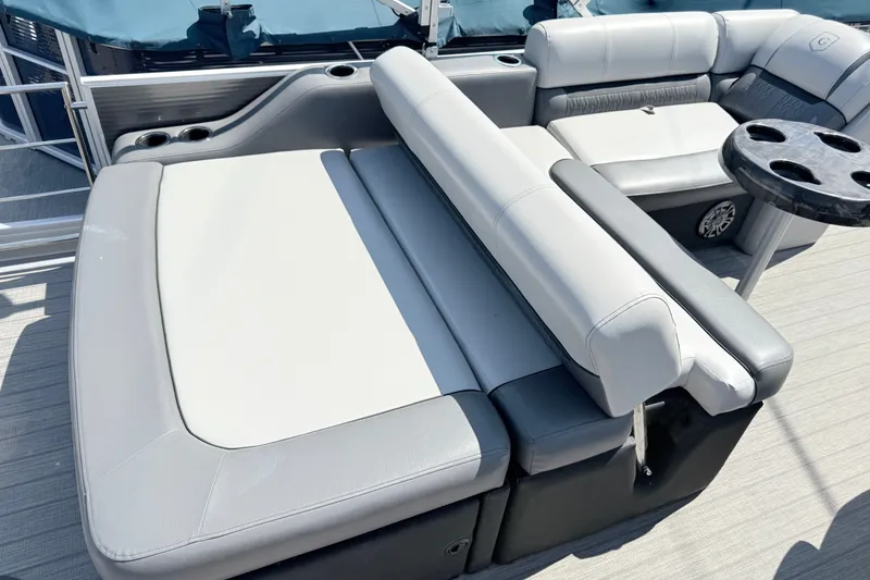 Slide: The Image of 2020 Godfrey Sweetwater 2286 C pontoon boat interior with plush seating and cup holders. - 13
