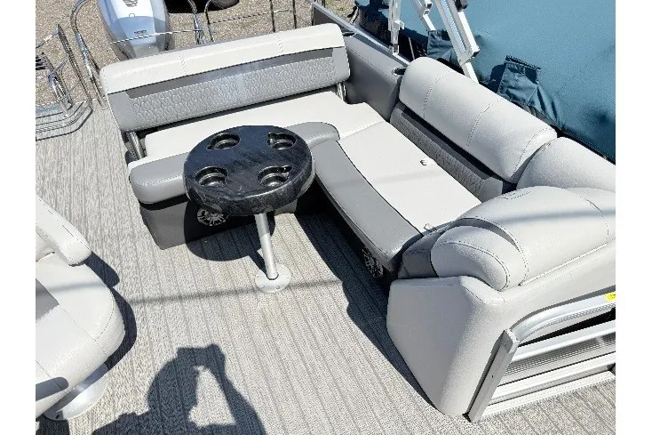 Slide: The Image of 2020 Godfrey Sweetwater 2286 C pontoon boat interior with gray seating and cupholder table. - 3