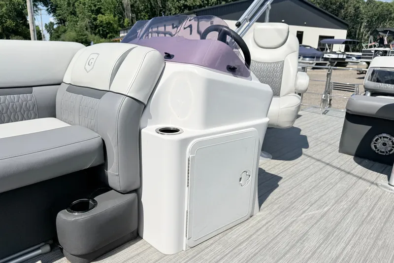 Slide: The Image of 2020 Godfrey Sweetwater 2286 C pontoon boat interior with plush seating and steering console. - 12
