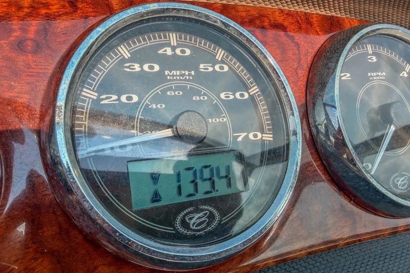 Slide: The Image of Close-up of 2011 Cobalt 210 speedometer and tachometer with wood grain dashboard. - 15