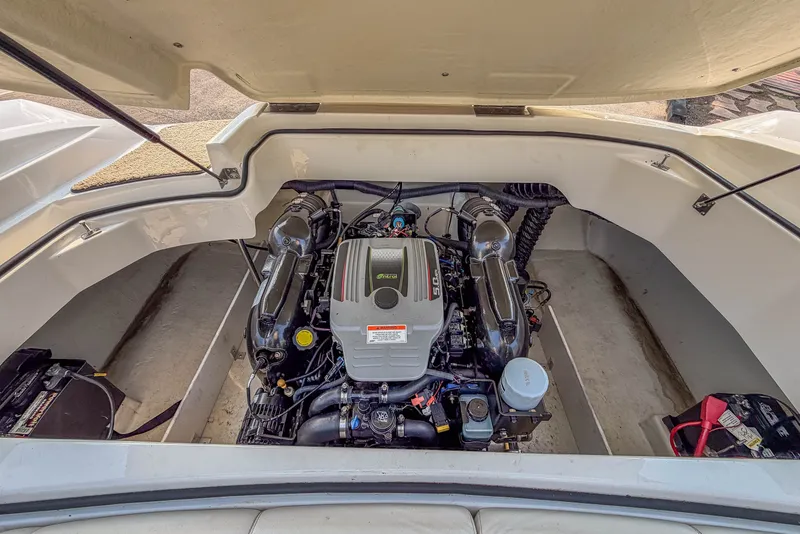 Slide: The Image of Engine compartment of a 2011 Cobalt 210 boat, showcasing the motor and components. - 23
