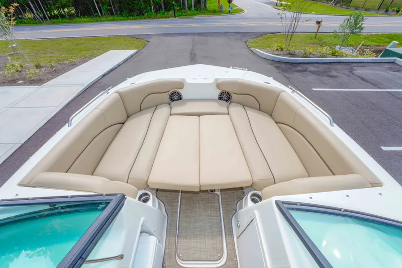 Slide: The Image of 2020 NauticStar 203 DC boat with spacious beige seating and modern design. - 19