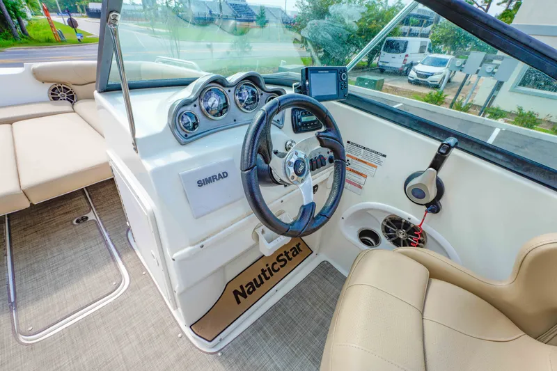 Slide: The Image of Interior view of 2020 NauticStar 203 DC boat with steering wheel and dashboard. - 20