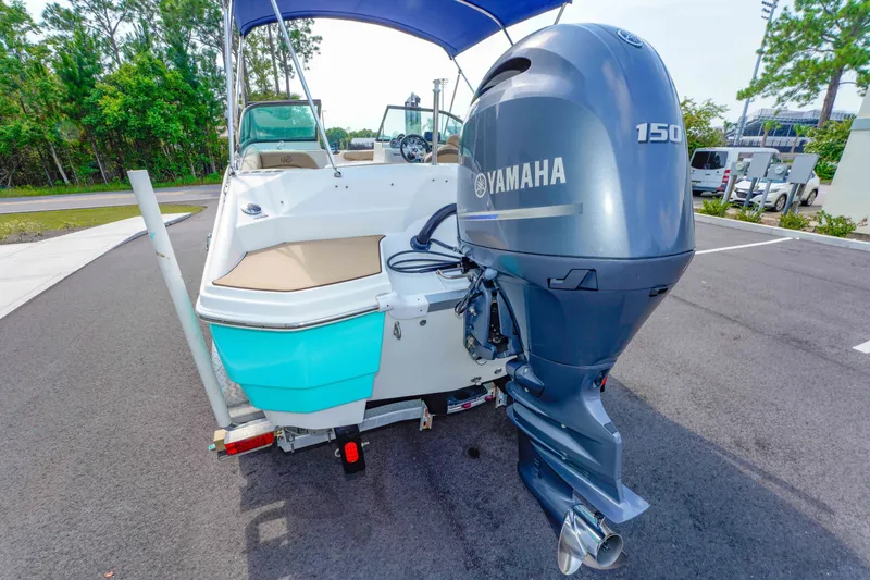 Slide: The Image of 2020 NauticStar 203 DC boat with Yamaha 150 engine on a trailer. - 10