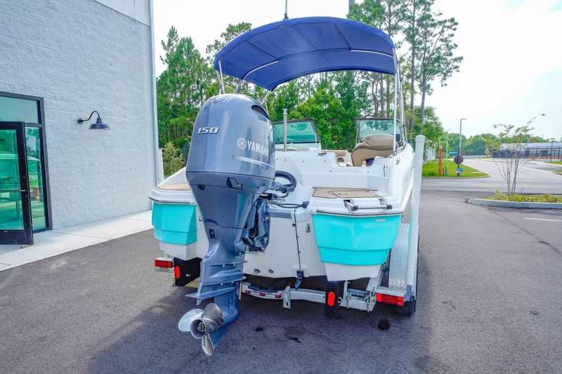 Slide: The Image of 2020 NauticStar 203 DC boat with Yamaha 150 engine on a trailer. - 4