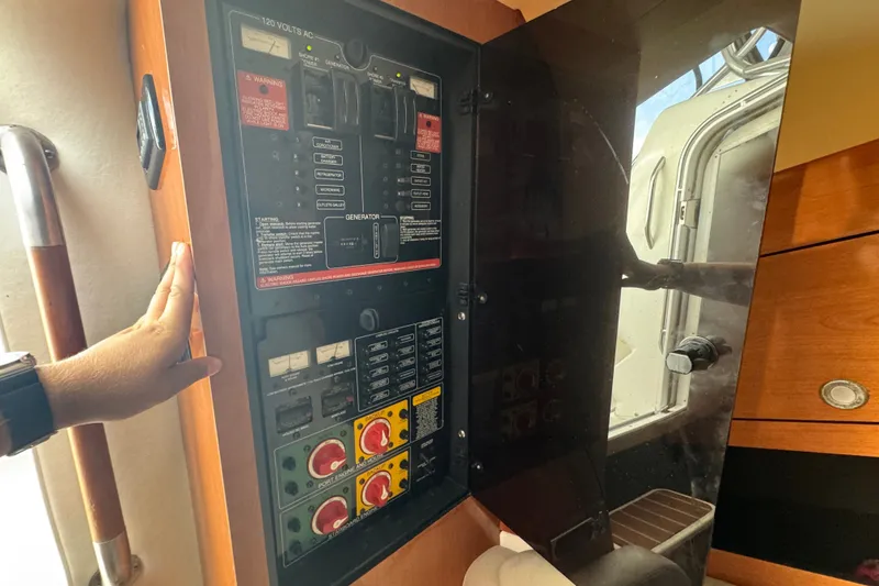 Slide: The Image of Electrical panel inside a 2008 Century 3200 Offshore boat cabin. - 31