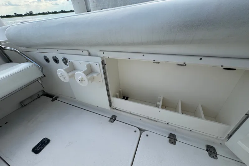 Slide: The Image of 2008 Century 3200 Offshore boat interior storage compartment with open hatch and seating. - 12