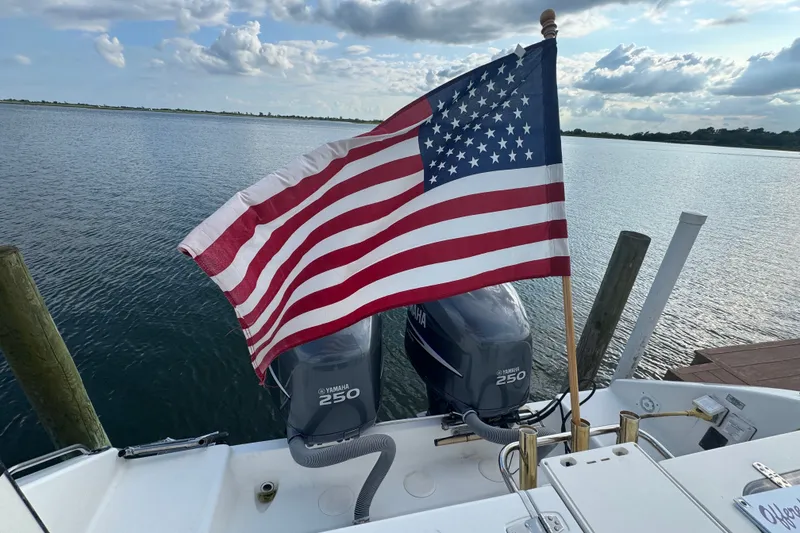 Slide: The Image of American flag on a 2008 Century 3200 Offshore boat with Yamaha engines. - 5