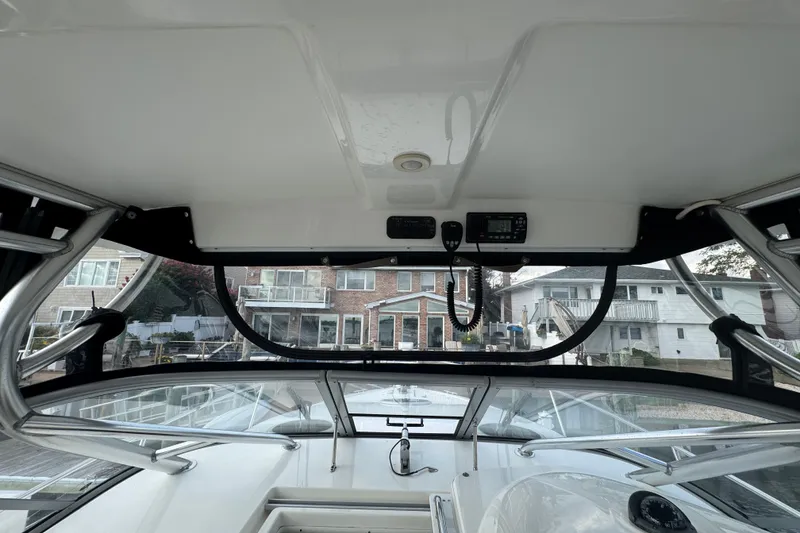 Slide: The Image of Interior view of a 2008 Century 3200 Offshore boat, showcasing the helm and dashboard. - 8