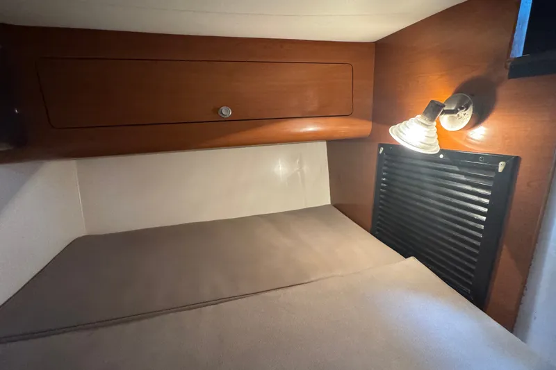 Slide: The Image of Interior cabin of 2008 Century 3200 Offshore boat with cozy bed and reading light. - 25