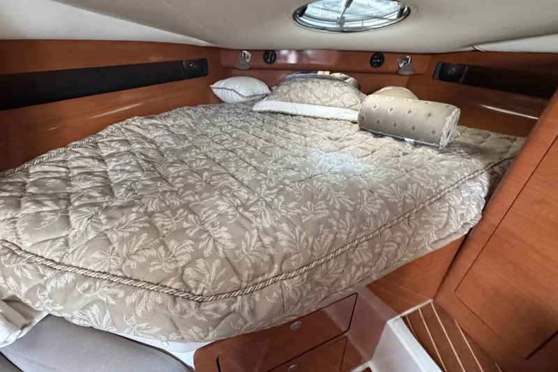Slide: The Image of Luxurious cabin interior of 2008 Century 3200 Offshore boat with cozy bedding. - 29