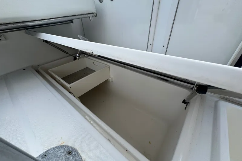 Slide: The Image of Open storage compartment on 2008 Century 3200 Offshore boat, showcasing interior space. - 10