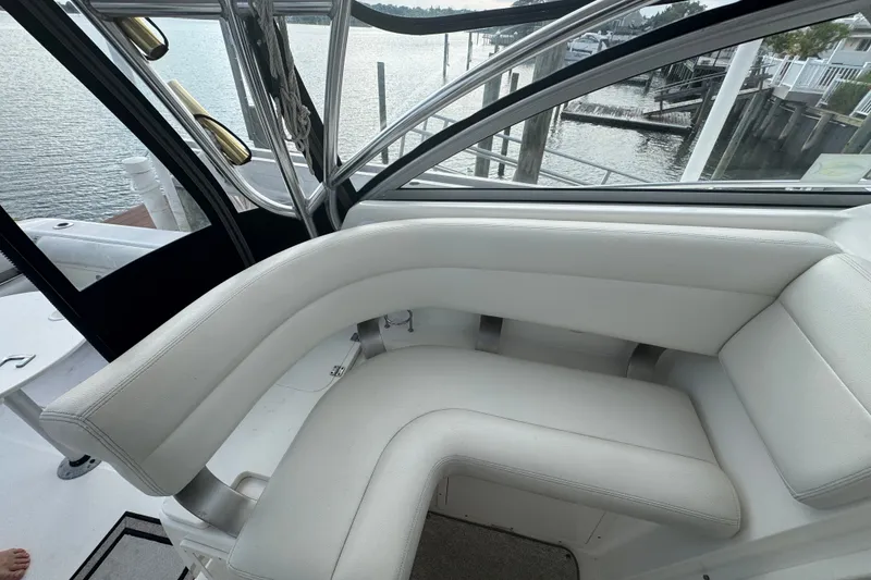 Slide: The Image of Luxurious seating on a 2008 Century 3200 Offshore boat, overlooking a serene waterfront. - 6