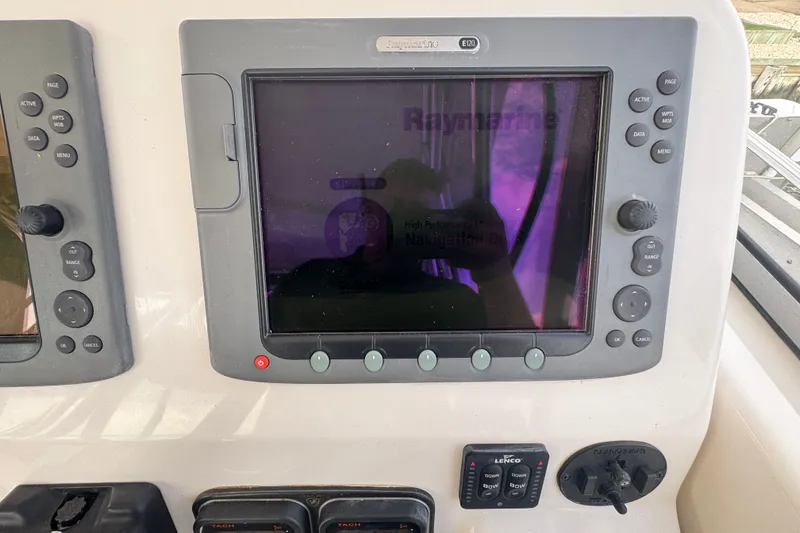 Slide: The Image of Raymarine E120 navigation display on 2008 Century 3200 Offshore boat dashboard. - 15