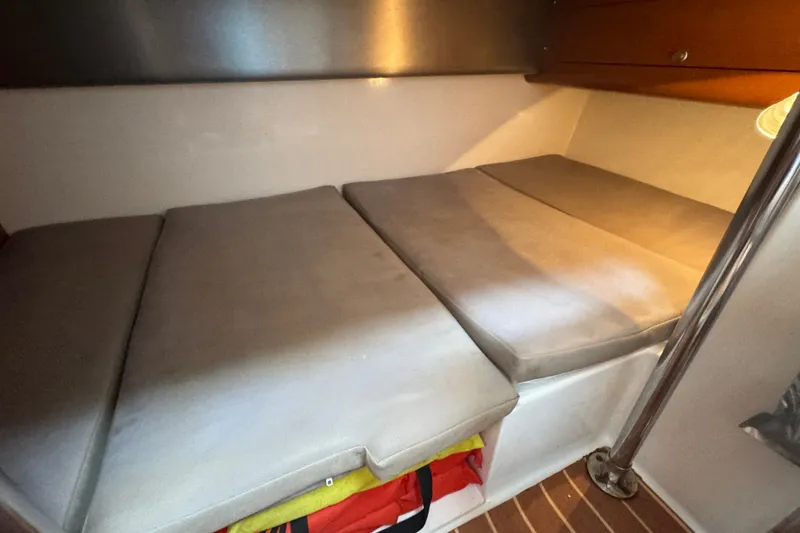 Slide: The Image of Interior cabin of 2008 Century 3200 Offshore boat with cushioned seating. - 24