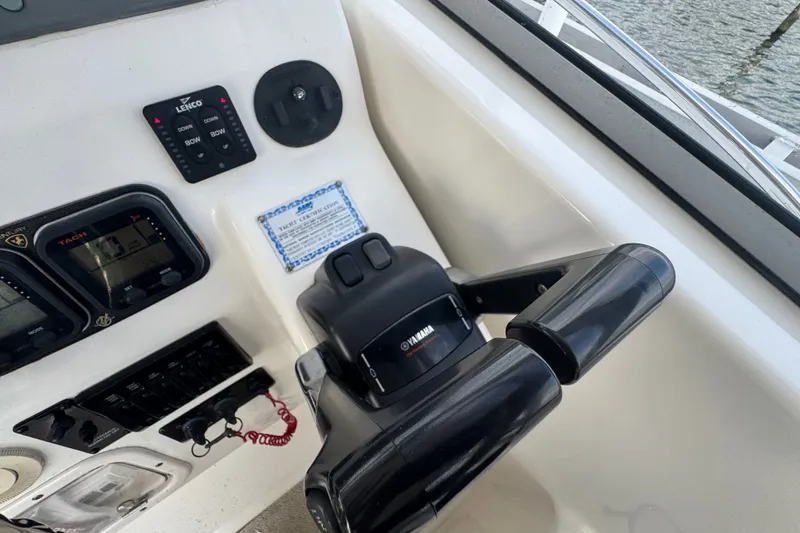 Slide: The Image of Control panel of a 2008 Century 3200 Offshore boat with Yamaha throttle. - 16
