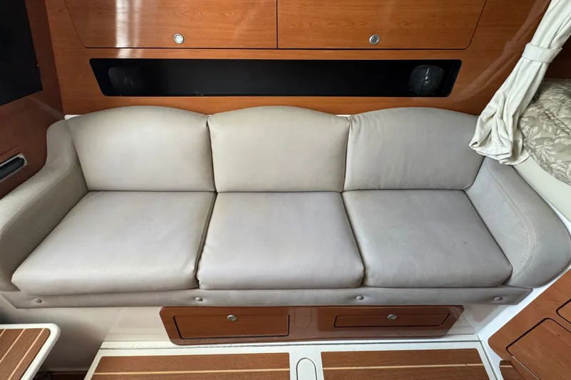 Slide: The Image of Beige leather sofa in 2008 Century 3200 Offshore boat interior. - 21