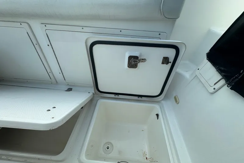 Slide: The Image of 2008 Century 3200 Offshore boat storage compartment with open hatch and clean interior. - 9