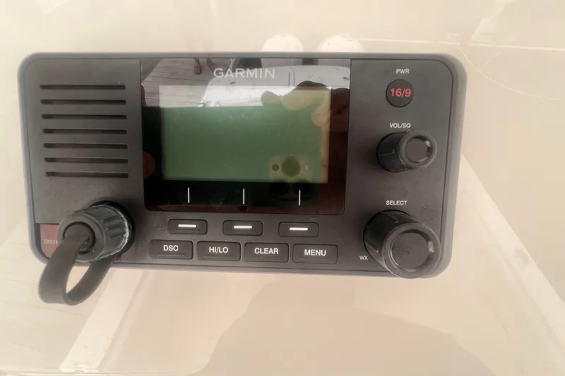 Slide: The Image of Garmin marine radio on 2019 Regulator 28 Forward Seating boat dashboard. - 12