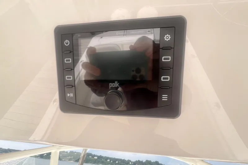 Slide: The Image of Polk audio control panel on 2019 Regulator 28 Forward Seating boat dashboard. - 14