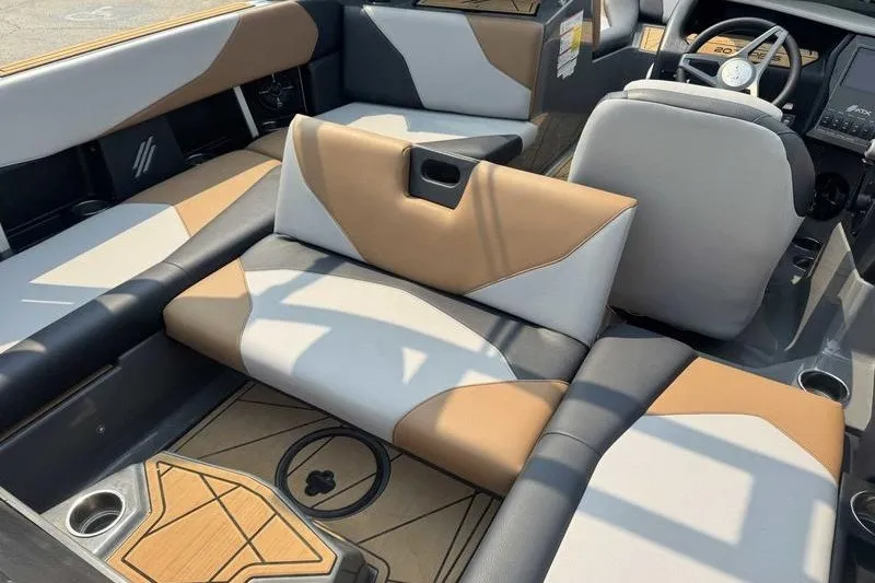 Slide: The Image of 2022 ATX Surf Boats 20 Type-S interior with stylish tan and gray seating. - 13