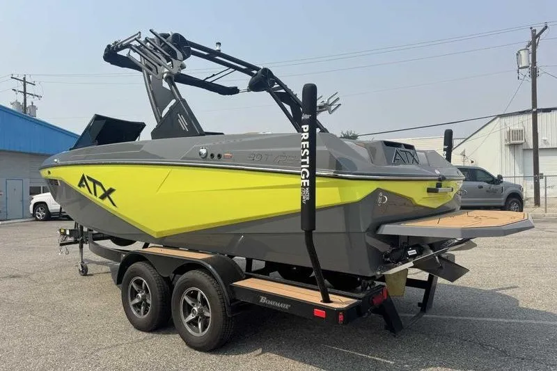 Slide: The Image of 2022 ATX Surf Boats 20 Type-S on trailer, vibrant yellow and gray design. - 19