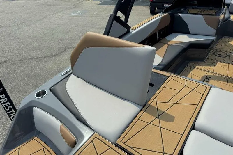 Slide: The Image of 2022 ATX Surf Boats 20 Type-S interior with tan and gray seating. - 17