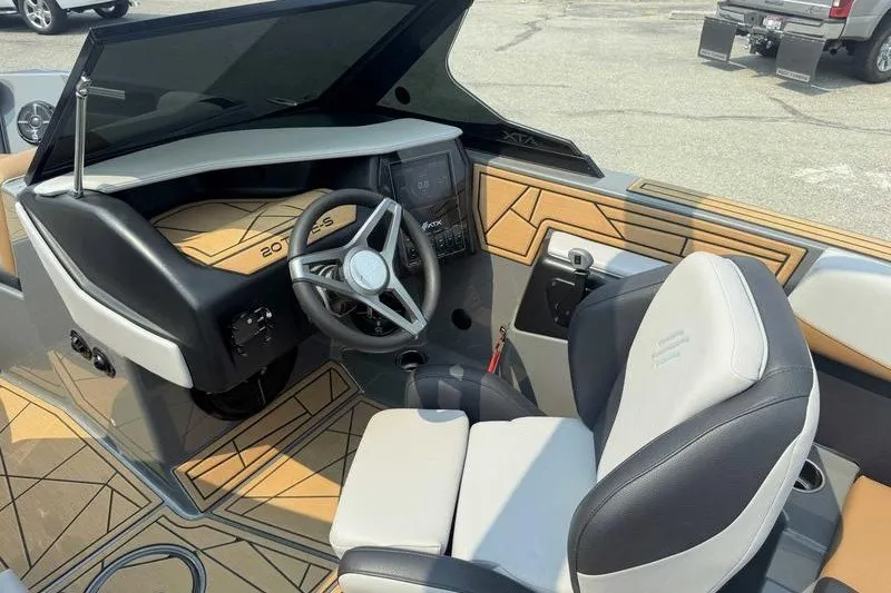 Slide: The Image of 2022 ATX Surf Boats 20 Type-S interior with modern dashboard and steering wheel. - 12